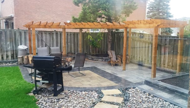 a patio with a grill and grilling area