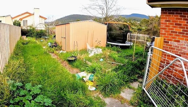 Junk-filled backyard, illustrating the type of property Easy Sell SA helps homeowners sell without n