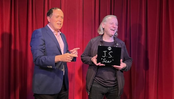 Bay Area mentalist David Martinez makes an on-stage helper laugh during a mentalist experience