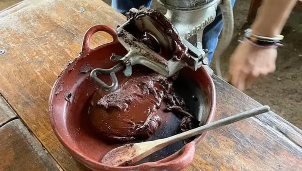 a person is using a grinder in a bowl