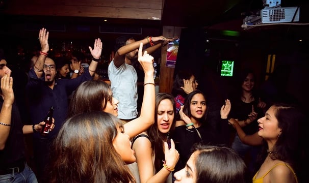 a group of people standing around a party