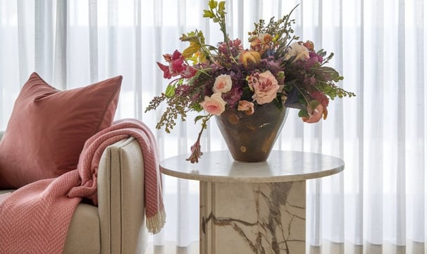 a vase with flowers in a living room