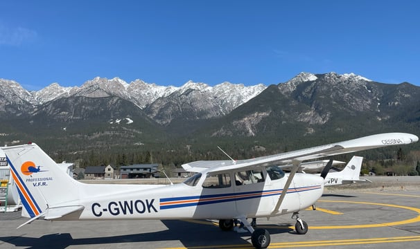 Picture of C-GWOK, a C172 with a backdrop consisting of beautiful mountains of BC