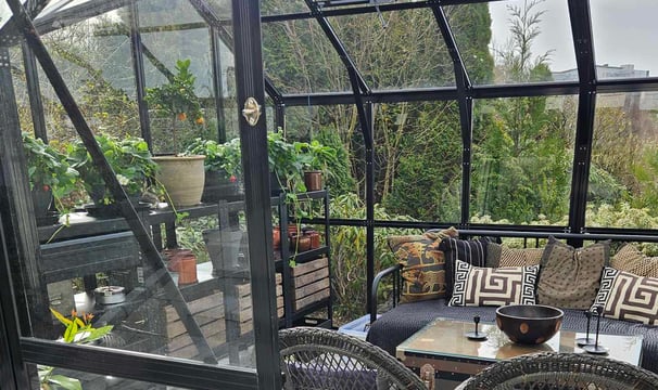 A garden design in Norway by garden designer Magnus Steen Showing the interior of a greenhouse