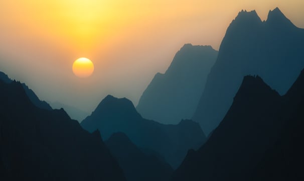 a sunset over a mountain range with a bird flying by. arbab naimat kasi, Quetta, balochistan