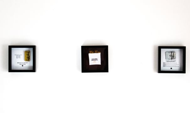 a white wall with frames for ambitious people