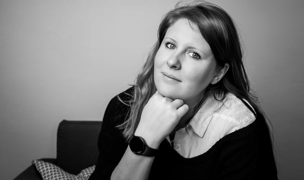 a woman with a black and white photo of a woman with a watch on her