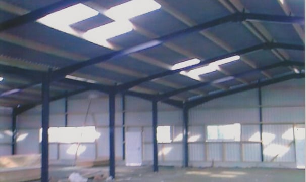 a large open space with a long metal structure
