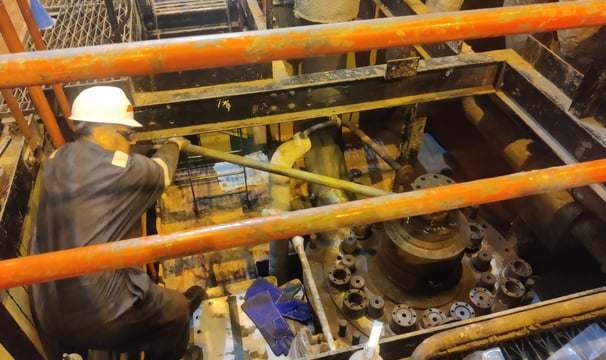 A CMS technician working on a steam turbine.