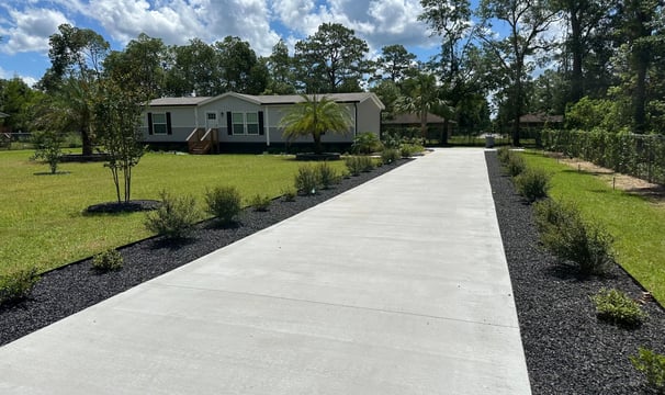 a driveway with a driveway and a house