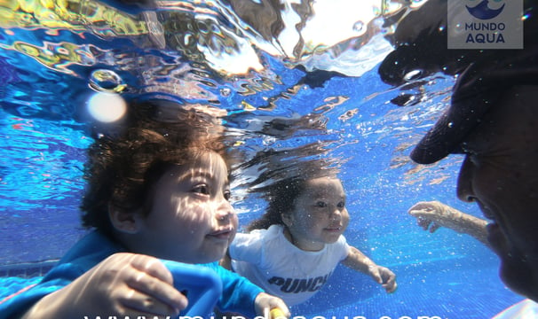 two little boys swimming in the water