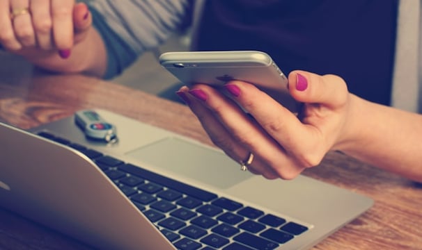 woman holding silver iPhone 6 mobile development