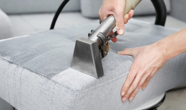 lifting a dirt from sofa