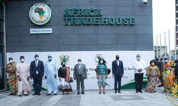 a group of people standing in front of a building