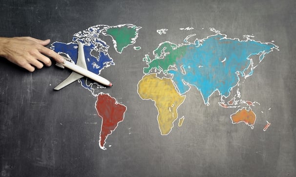top world travel destinations - a plane flying over a chalkboard with a map of the world