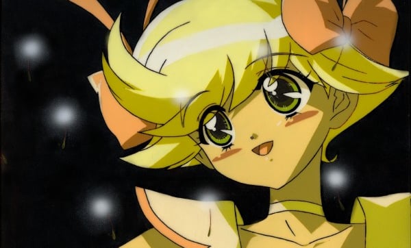 a woman with blonde hair and a yellow dress