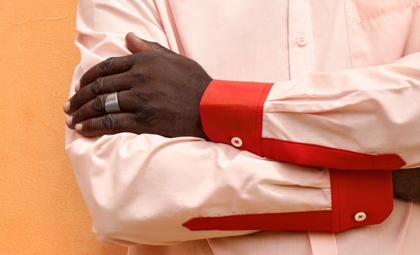 a man in a white shirt and red tie dye