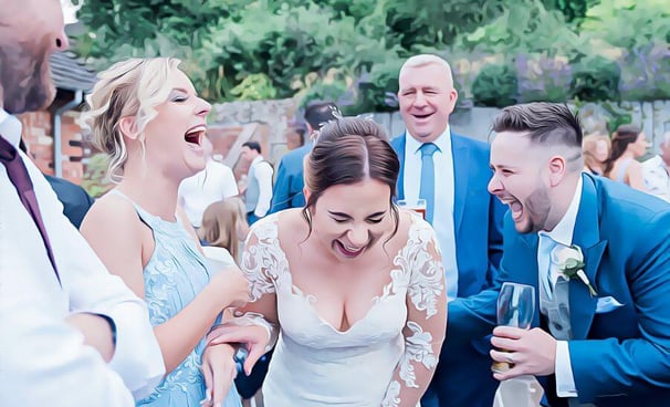 guests laughing at magician