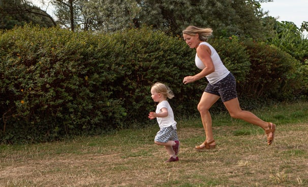 Mother and daughter running