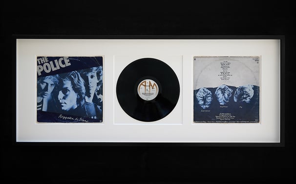 a picture of a record album with a record on it inside of a professional frame