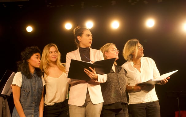 Group of five actors all look to the side in anticipation during workshop of Wonder