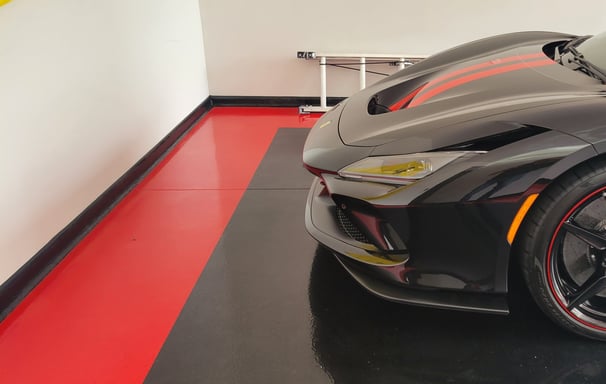 Black and red solid color epoxy garage floor with red border