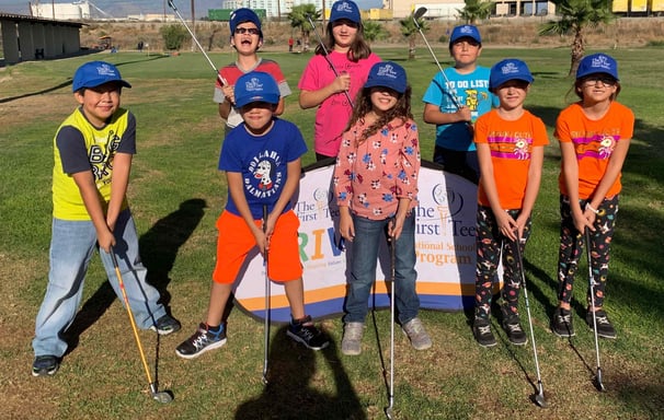 Enhancing Forward Action Inc. image of a group of children golfers posing