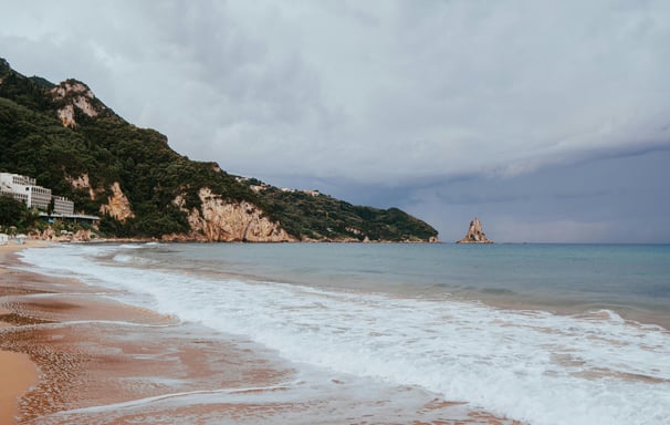 a beach with a boat in the water