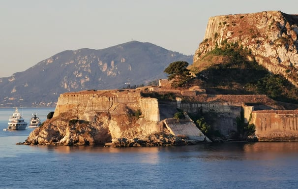 a boat is docked in front of a castle