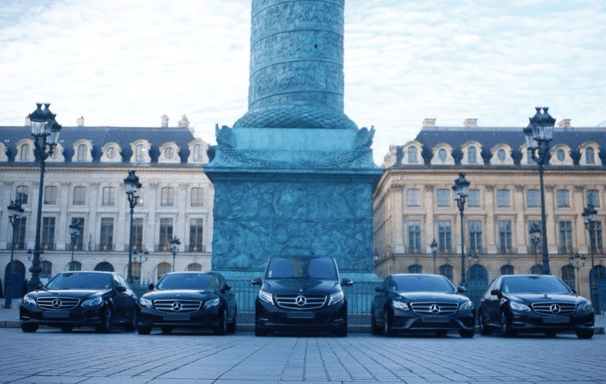a group of cars parked in vendome place paris