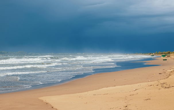 a beach with a boat in the water