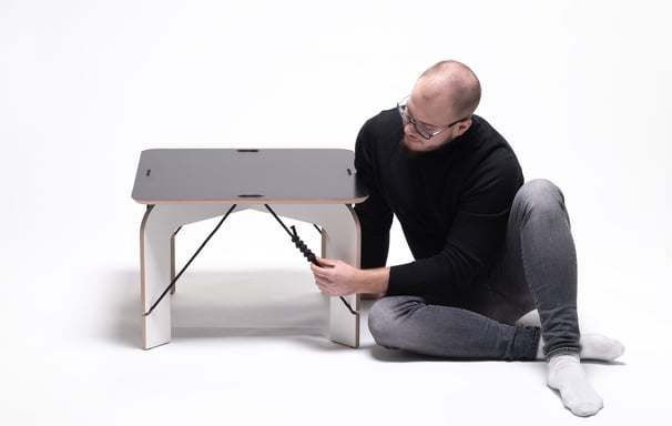 SOLIDO zero-waste coffee table: CNC-cut plywood sheet transforming into legs and tabletop with jute 