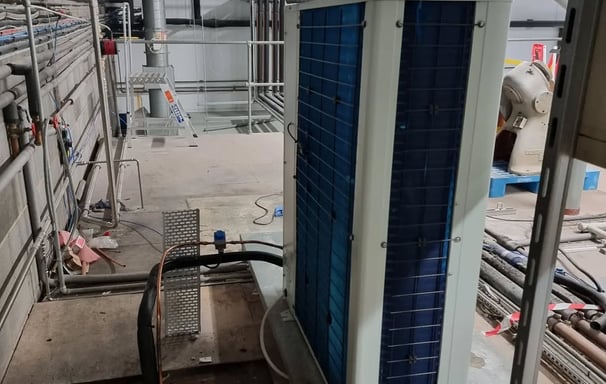 Exterior view of Maxx Cold split system condenser installed outside a cold storage facility