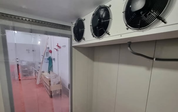 Close-up of heavy-duty evaporators installed in a commercial cold storage facility