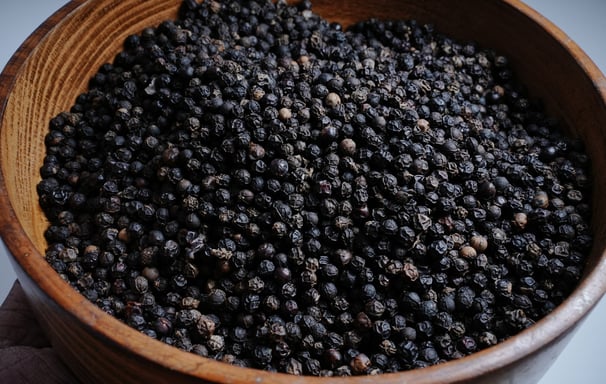 Black Pepper Placed on a Wooden Container