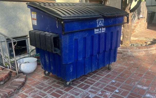 Our 3 cubic yard bin being filled with some wood, tile, and insulation.