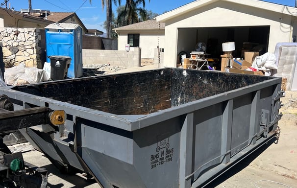 Our 11 cubic yard dumpster helping with a garage cleanup. 