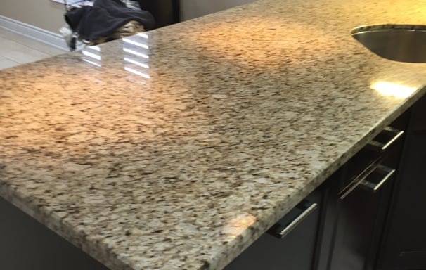 Finely polished Granite Kitchen Counter reflects light beautifully