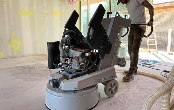 Concrete Grinding using a Lavina Propane floor grinder to remove thinset