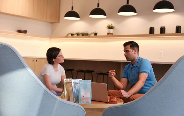 Frida Murillo and Zaheen Hamidani sitting at a table