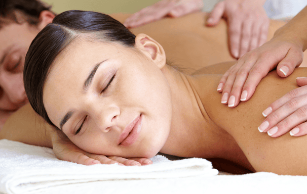 a woman getting a massage at a spa