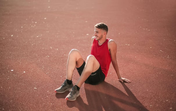 Young man sitting on floor