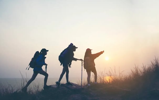 Group of people hiking to enhance physical health and enjoy nature