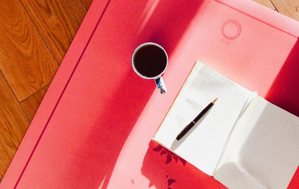 Cup of coffee and notebook, showing blogging and ghost blog writing services available.