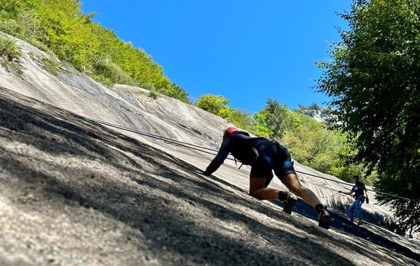 Climbing during a team building in Val di Mello
