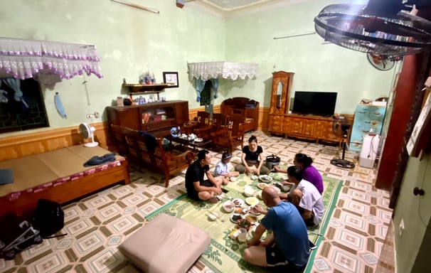 a group of people sitting around a table