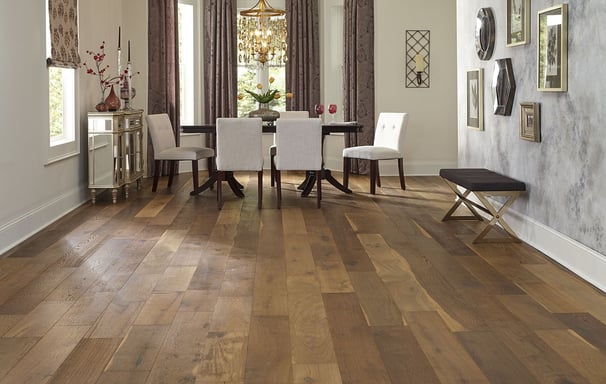 Beautifully finished hardwood floor in an elegant dining room, with a warm, medium toned wood.