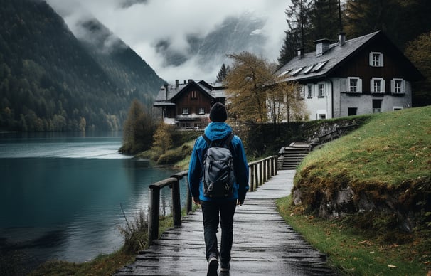 a person walking down a path with a backpacker