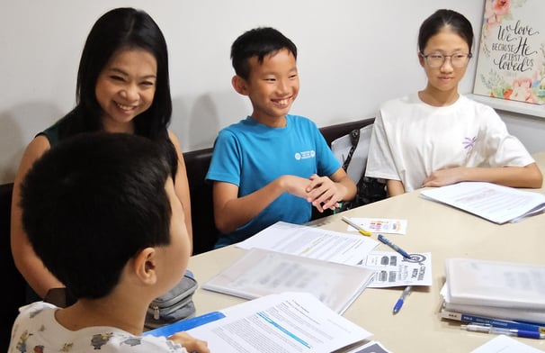 Thriving Kids Club Founder Mrs Serene Wee and students at English Tuition Class