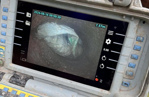 Plastic Carrier Bags Blocking the inside of a drain in Warrington